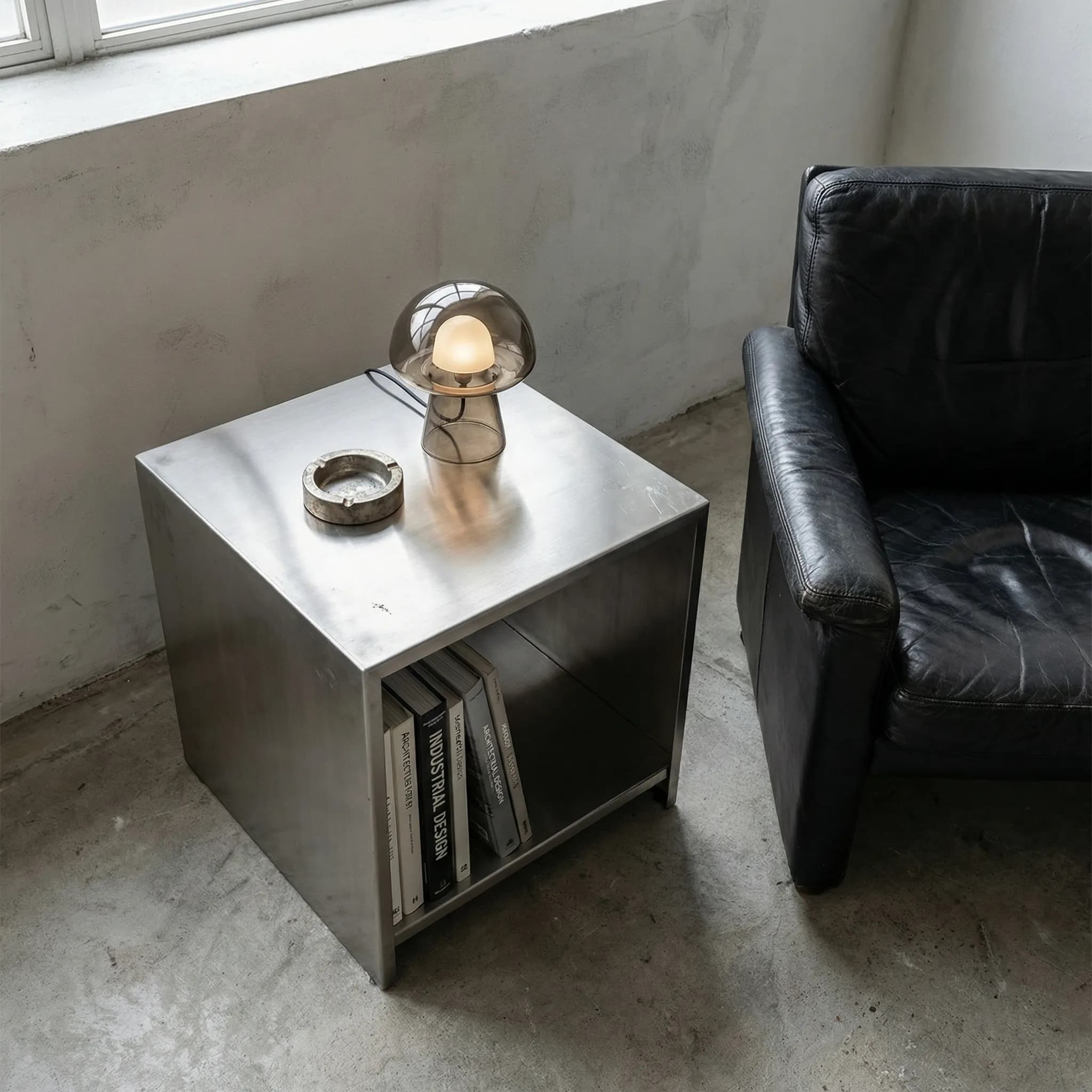Industrial steel side table with smoked glass lamp